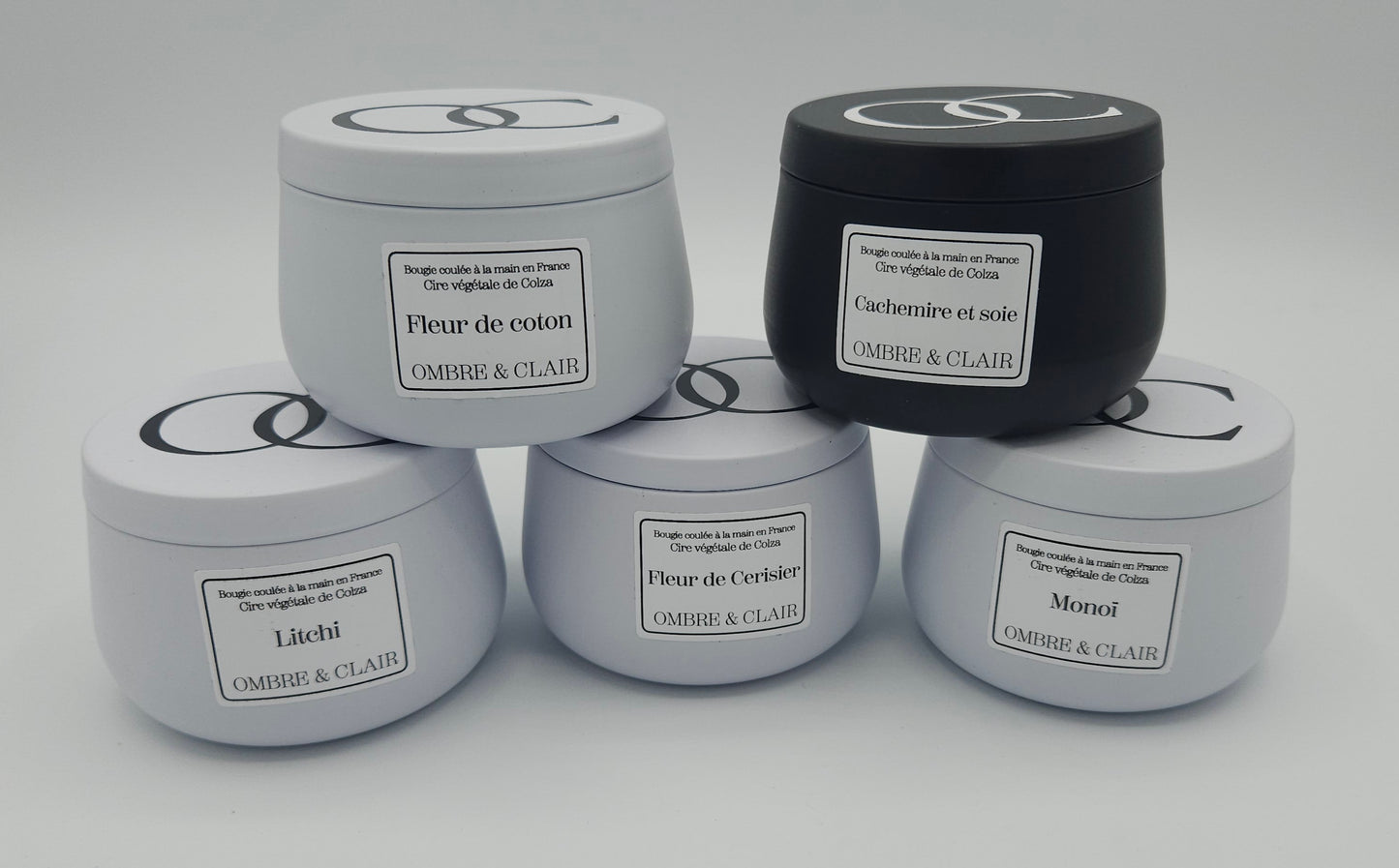 Gamme de bougies végétales et artisanales Ombre et Clair - Parfum de Grasse : Cachemire et Soie, Fleur de Cerisier, Fleur de Coton, Monoï, Litchi. Contenant recyclable en métal.